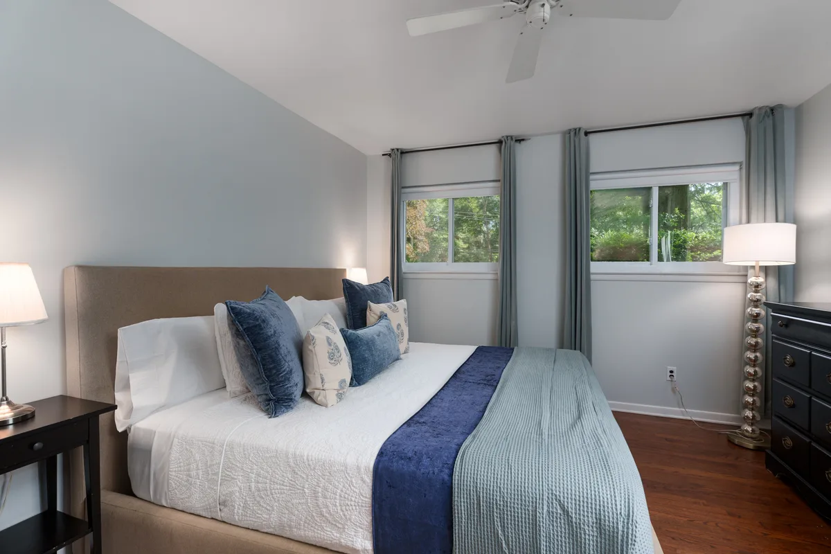 Primary bedroom with king bed at Heart & Home Princeton Retreat